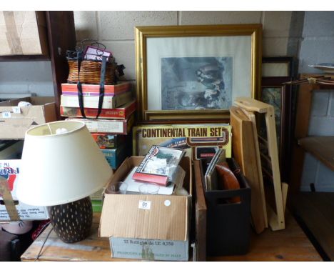 Shelf of mixed items including records, lights and games