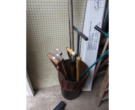 Leatherette container with quantity of garening tools including rake and rotovators