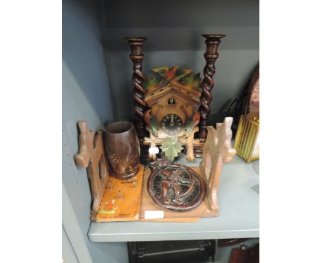 A treen selection including Cuckoo clock, twist stem candlesticks, sliding book ends, etc