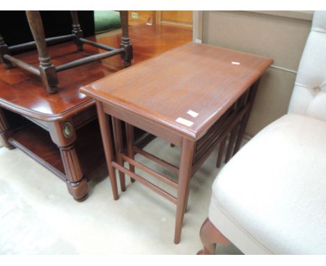 A vintage stylised nest of three tables