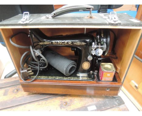 A vintage Singer sewing machine and case