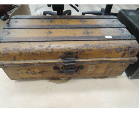 A vintage tin travel trunk