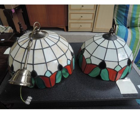 A pair of tiffany style ceiling light shades