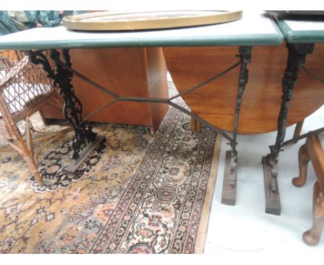 A vintage cast garden table with later top