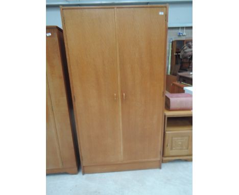 A vintage golden oak wardrobe by Stag 