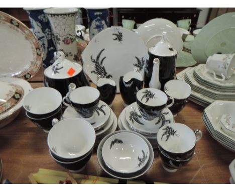 A part tea service by Royal Albert in the Night and Day design