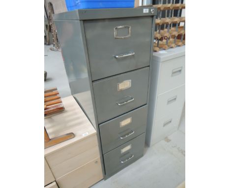 A vintage metal 4 drawer filing cabinet