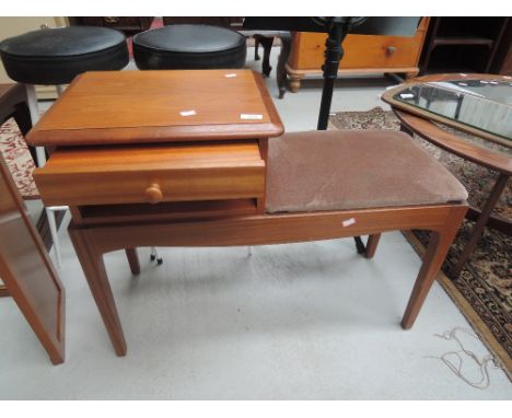 A vintage teak telephone table