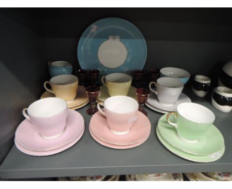 A harlequin Wedgwood tea service and six ruby glass spirit glasses