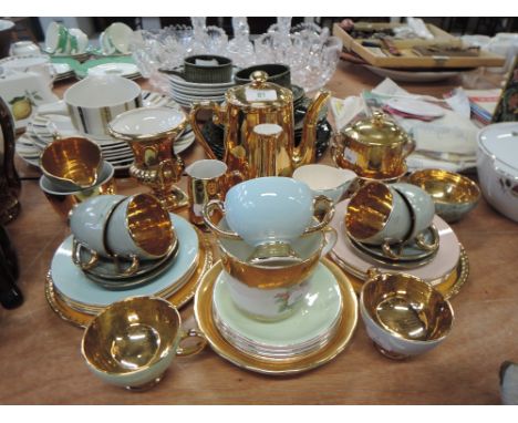 A selection of gilt ware coffee cups and saucers, coffee pot etc