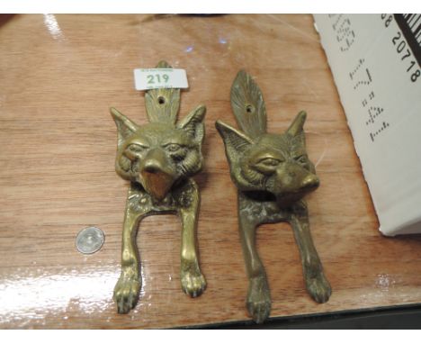 A pair of brass cast door knocker in the form of a fox possibly hunt related