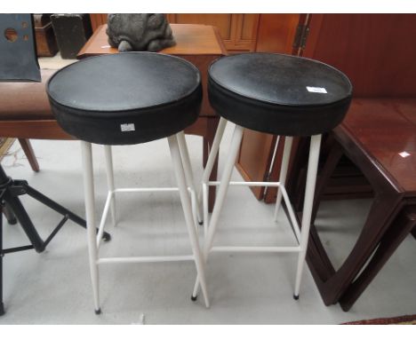 A pair of vintage metal frame bar stools