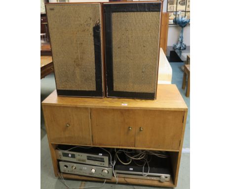 A Mid Century oak stereo cabinet (with a Glasgow School of Art paper label) with three doors and open shelf, 75cm high x 101c