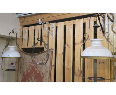 A pair of Victorian wrought iron ceiling oil lamps with white shades and another light frame (def) Condition Report: Availabl