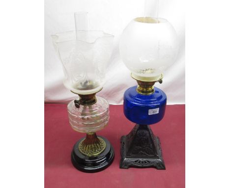 Early C20th oil lamp with Bristol blue reservoir on cast alloy square base cast with flowers H62.5cm, late C19th oil lamp wit
