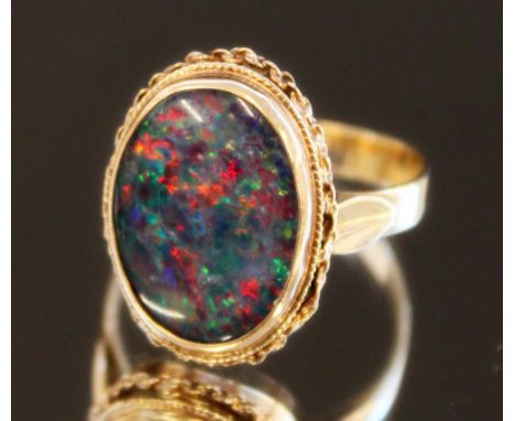 9ct yellow gold ring set with large opal, stamped 9ct, size P, 4.0g 