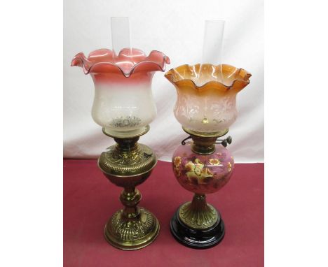 Late C19th oil lamp with embossed brass reservoir on embossed circular base H60cm, similar period oil lamp with puice pink gl