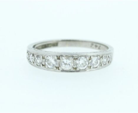 18ct white gold half infinity ring set with nine brilliant cut diamonds, stamped 18ct, size N1/2, 3.6g.  Total ct weight appr