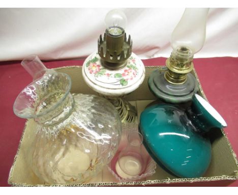C20th oil lamp with green glass reservoir and circular embossed brass foot H41cm, C20th table lamp in the form of an oil lamp