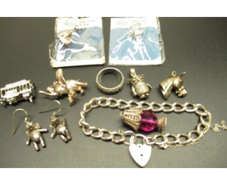 Hallmarked silver charm and bangle bracelets, six Sterling silver and other charms, pair of articulated elephant ear rings, a