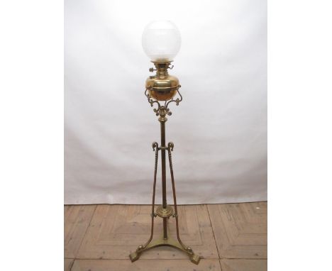 C20th Art Nouveau Barker &amp; Co. Ltd. Kensington brass rise and fall standard lamp on triform base, H132cm lacking chimney 