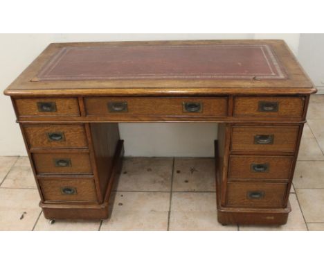 Nick Hancock Collection - small Edwardian oak pedestal desk, with gilt tooled red leather top above three frieze and six draw
