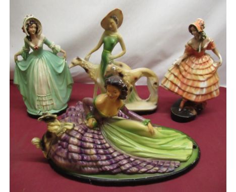 1930's painted plaster figure of woman in dress with terrier, impressed number RD865417, three other similar figures (4) 