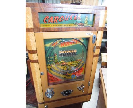 1950s Parkers Automatic maple and walnut cased Penny in the Slot Alwin flicker Carousel machine, W50cm D16cm H82cm 