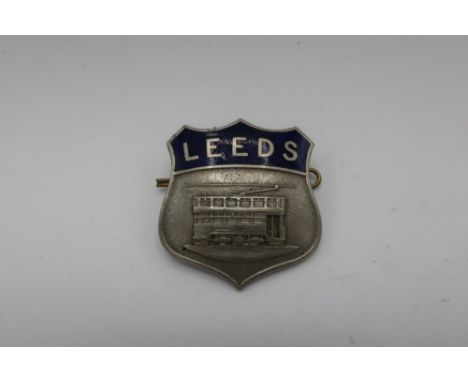 White metal and blue enamel Leeds Tram shield shaped cap badge, by Firmin London 