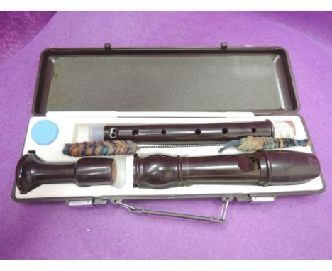 A Dolmetsch treble recorder , in Z recorder fitted case, with fingering diagrams 