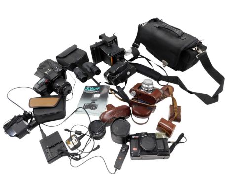  A quantity of camera equipment, to include a Yashica 200AF, and other cameras.