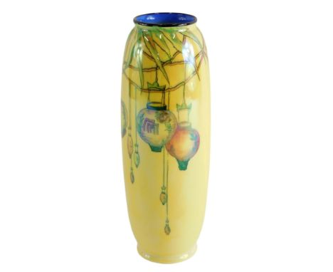 A Crown Ducal lustre glazed vase, decorated with Chinese lanterns, on a yellow ground, 26cm high. 