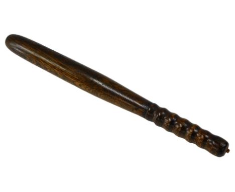A turned oak policeman's truncheon, 42cm long.