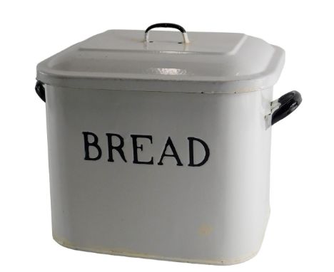 An early 20thC enamel and blue painted bread bin and cover, 34cm wide. (AF)