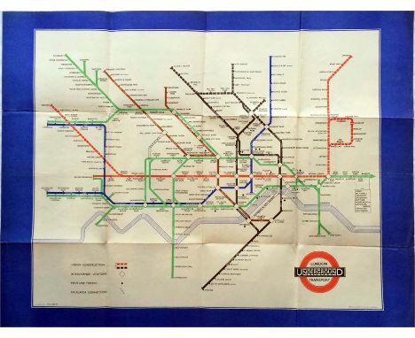 1940 London Transport Underground POSTER MAP designed by H C Beck and featuring a wide blue border. A war-time issue which sh