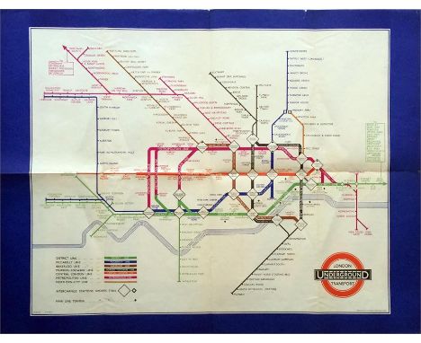 1936 London Transport Underground POSTER MAP designed by H C Beck and featuring a wide blue border. One of the short-lived se