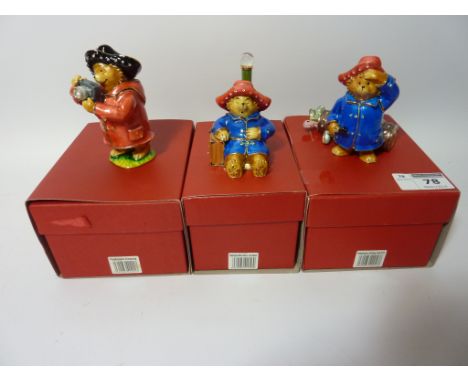 Three Paddington Bear Hidden Treasures trinket boxes - 'Paddington with Camera', 'Paddington Golfing' and 'Paddington Sleepin