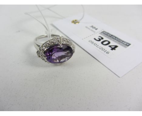 Hallmarked silver ring set with large oval amethyst