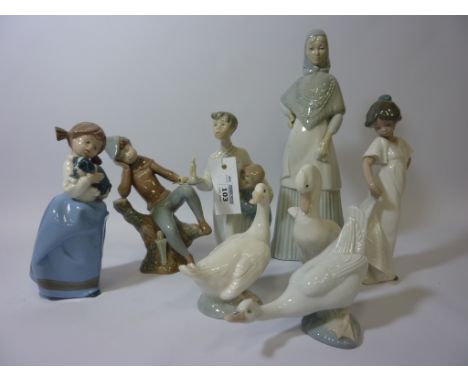 Nao figure group of two children H20cm, Nao figure of a girl holding a puppy, three Nao geese and three other Spanish figures