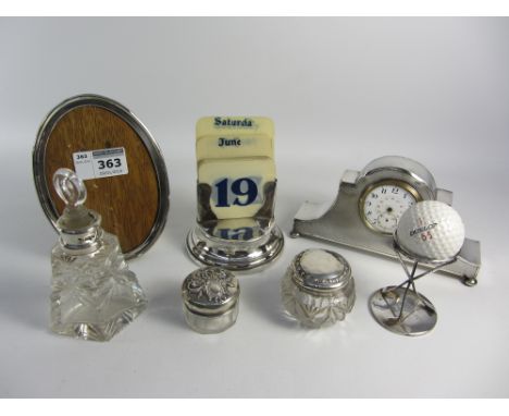 Silver clock case, golf trophy, perpetual calendar, photograph frame, dressing table items all hallmarked