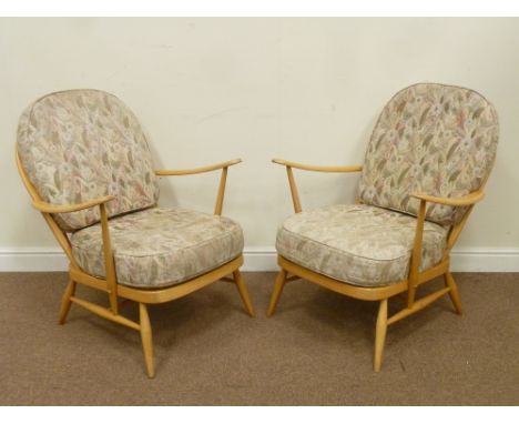 Pair light beech Ercol 'Easy chairs' with upholstered loose cushions and vintage retro shaped teak mirror