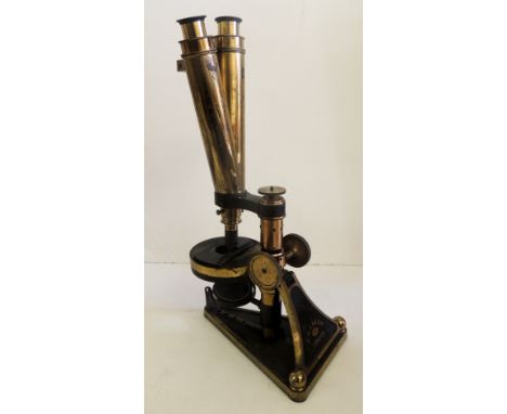 A 19TH CENTURY COMPOUND BINOCULAR MICROSCOPE BY R & J BECK, LONDON no.6407 having adjustable base and in original mahogany bo