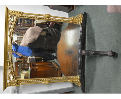 An attractive 19th Century gilt gesso overmantel mirror with openwork foliate top, rope border and slender side pillars, toge