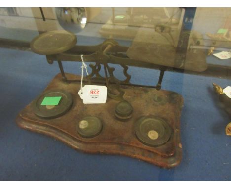 LATE 19TH CENTURY POSTAL SCALE, THE SERPENTINE SHAPED BASE SET WITH A PIERCED FRAME WITH SHAPED PANS AND FITTED WITH FIVE VAR