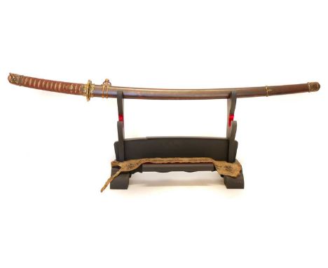 Japanese WWII Katana, 65cm cutting edge blade set in Shin Gunto mounts, with sword stand and ink script sash which translates