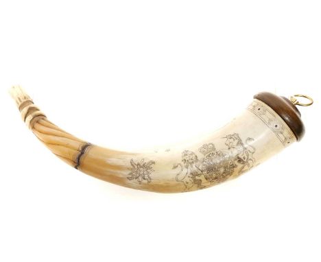 Finely hand-carved 21st century scrimshaw powder horn, decorated with royal coat of arms and various animal subjects. 35cm lo