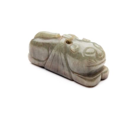 A CHINESE GREEN JADE CAT, QING DYNASTY (1644-1911) carved recumbent with paws outstretched and tail swished over the rear bod
