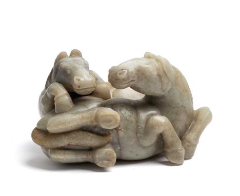 A LARGE CHINESE CELADON JADE 'HORSE' GROUP, LATE QING DYNASTY (1644-1911) carved in the Ming style, one horse recumbent, the 