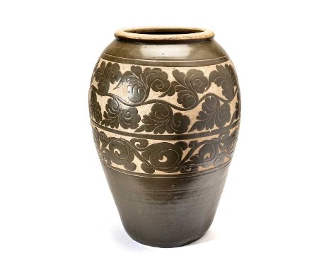 A LARGE AND IMPRESSIVE CHINESE 'CIZHOU' SGRAFFIATO 'PEONY SCROLL' JAR, YUAN DYNASTY (1279-1368) the baluster body rising from