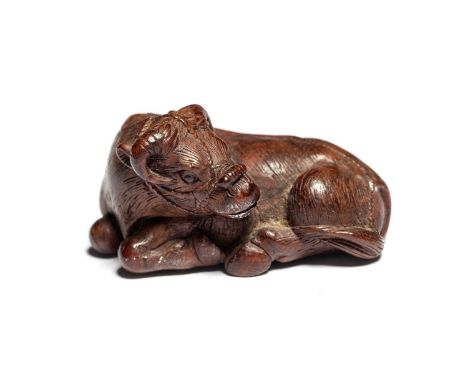 TWO JAPANESE CARVED WOOD NETSUKE OF A WATER BUFFALO AND A RAM, MEIJI PERIOD (1868-1912) the buffalo carved recumbent, the hea